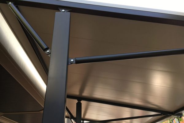 Close-up of Versatile Structures' insulated panel roofing with metallic finish