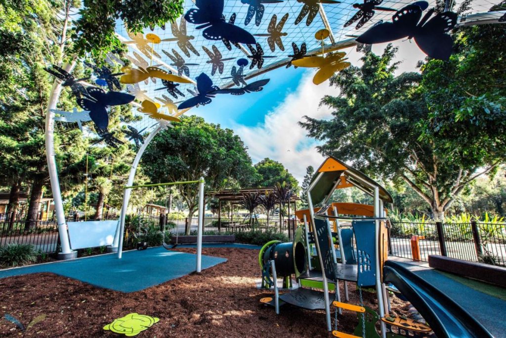 An custom, architecturally designed commercial shade structure solution for a kids playground by Versatile Structures