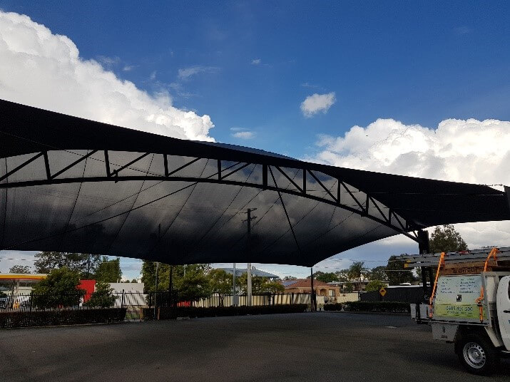 An install and forget shade solution for Brisbane Camperland designed, manufactured, and installed by Versatile Structures.