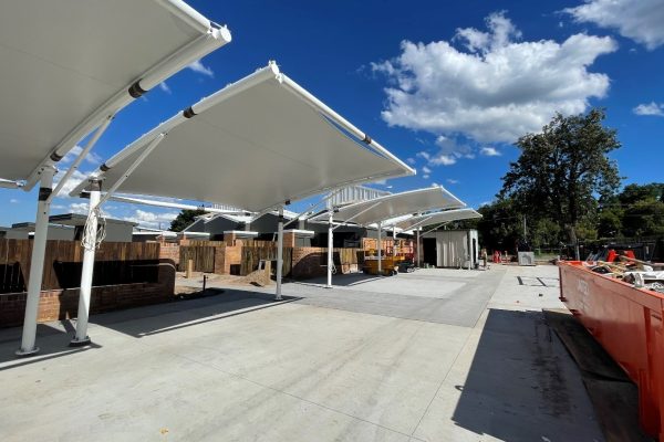 Waterproof shade sails installed for habitat on Juers by Versatile Structures